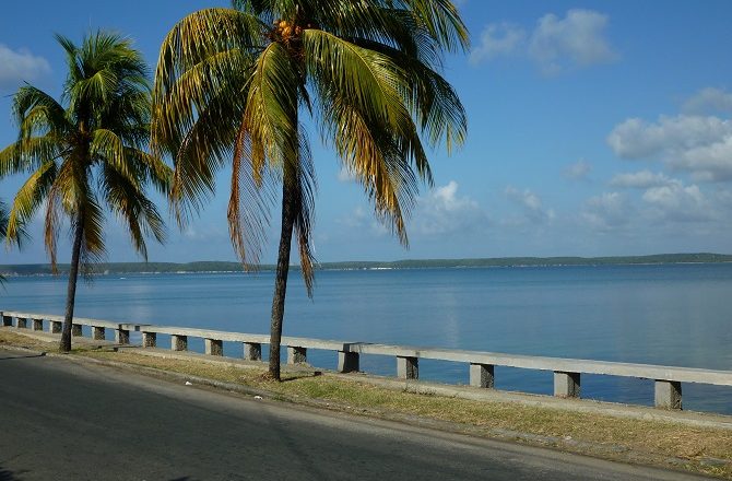 A road running alongside the Bay of Cienfuegos